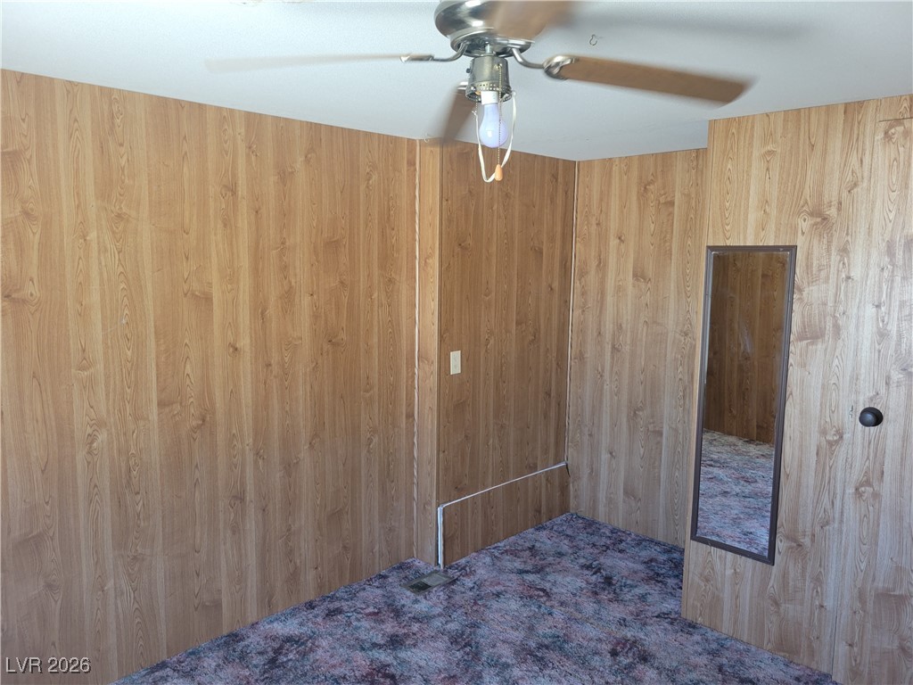 7950 South Wildhorse Road Pahrump, NV 89061 - Photo 12 of 28 Bedroom featuring a ceiling fan