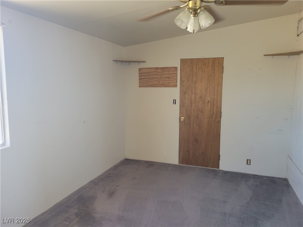 7950 South Wildhorse Road Pahrump, NV 89061 - Photo 23 of 28 Carpeted spare room featuring ceiling fan