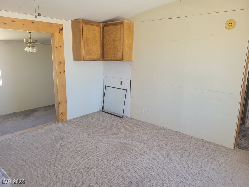 7950 South Wildhorse Road Pahrump, NV 89061 - Photo 27 of 28 Washroom featuring carpet flooring and a ceiling fan