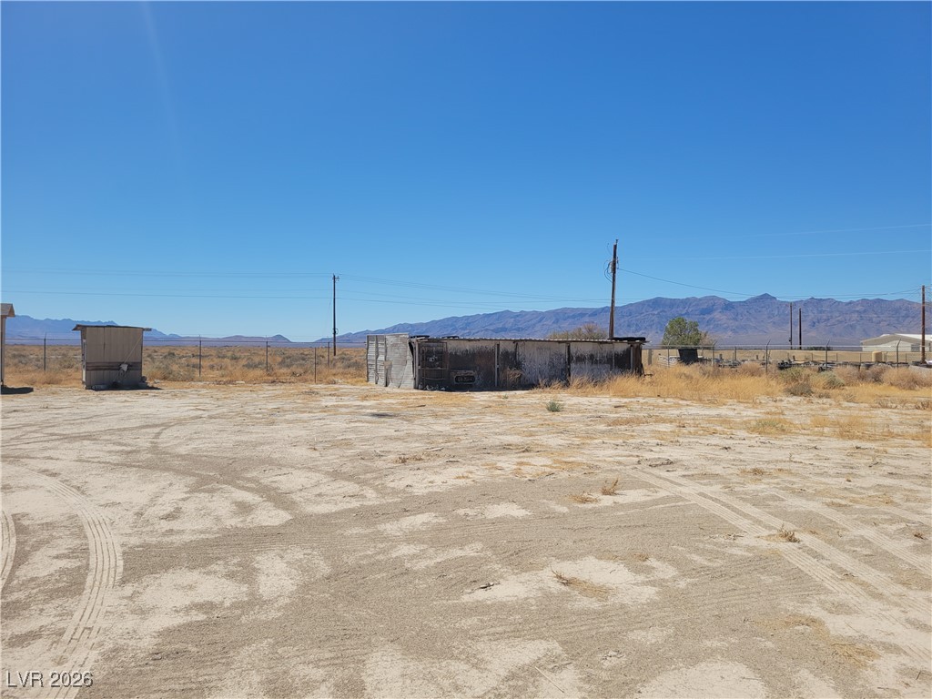 7950 South Wildhorse Road Pahrump, NV 89061 - Photo 6 of 28 View of yard featuring a view of countryside and a mountain view