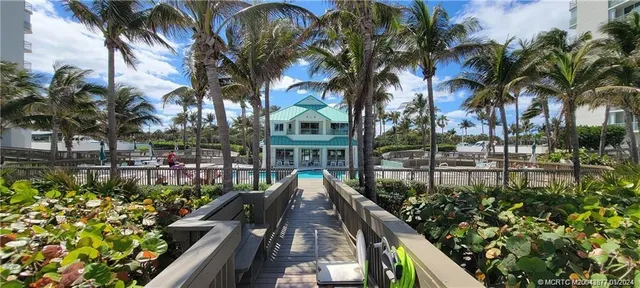 a view of a garden with sitting area