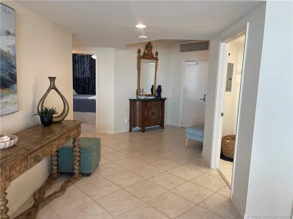 a kitchen with stainless steel appliances granite countertop a sink a stove a microwave a dining table and chairs