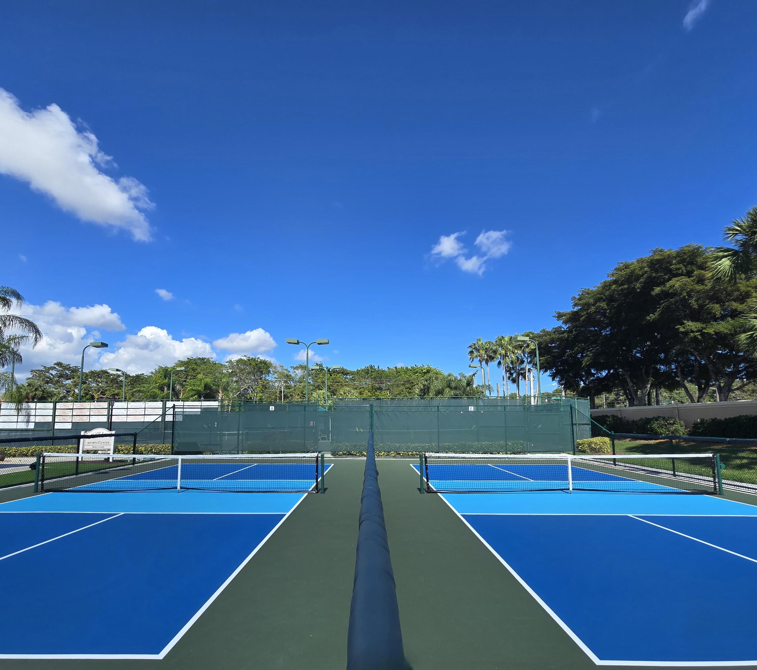 11853 Grove Ridge Lane Boynton Beach, FL 33437 - Photo 36 of 59 a view of a tennis court
