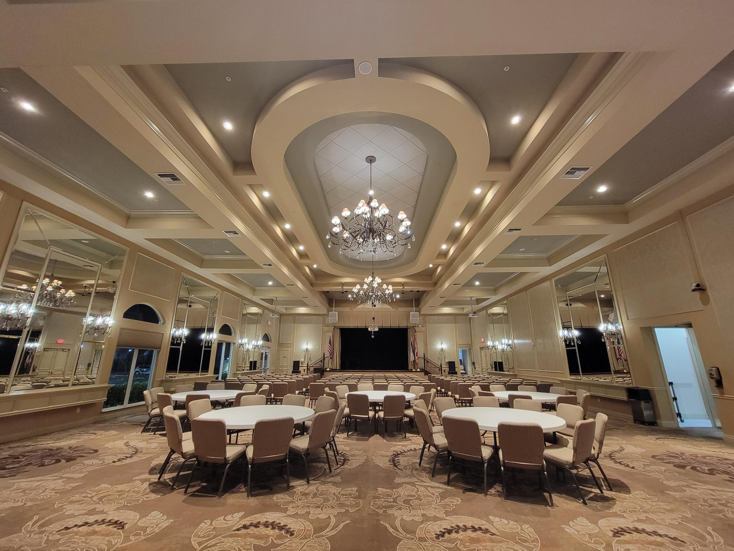 11853 Grove Ridge Lane Boynton Beach, FL 33437 - Photo 47 of 59 a living room with lots of furniture and a chandelier