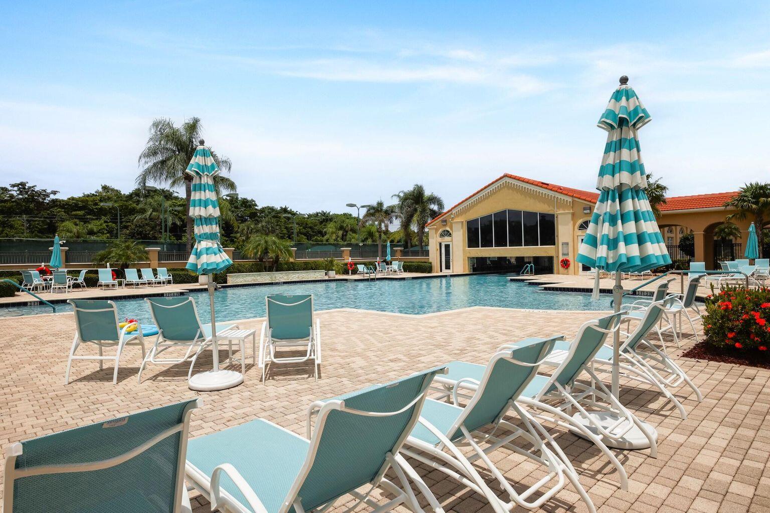 11853 Grove Ridge Lane Boynton Beach, FL 33437 - Photo 55 of 59 a view of a patio with couches table and chairs with wooden floor and fence