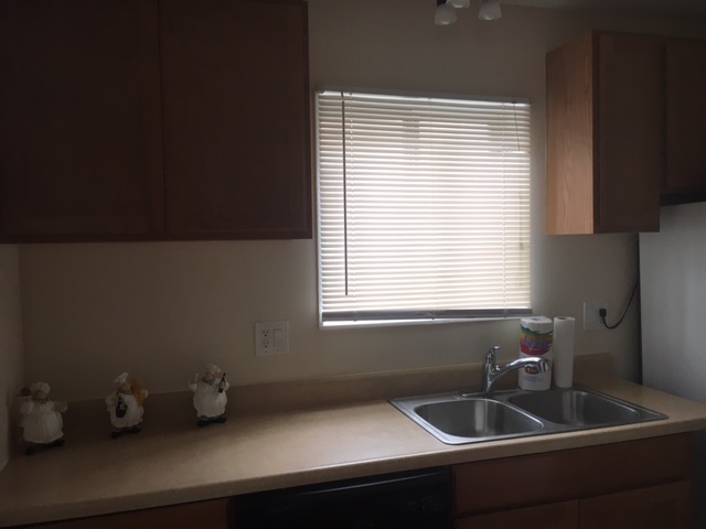 8010 West Lyons Street, Unit B Niles, IL 60714 - Photo 4 of 19 a room with a window and cabinets