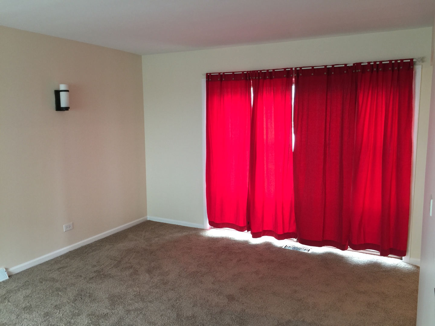 8010 West Lyons Street, Unit B Niles, IL 60714 - Photo 7 of 19 a view of a room with red walls and wooden walls