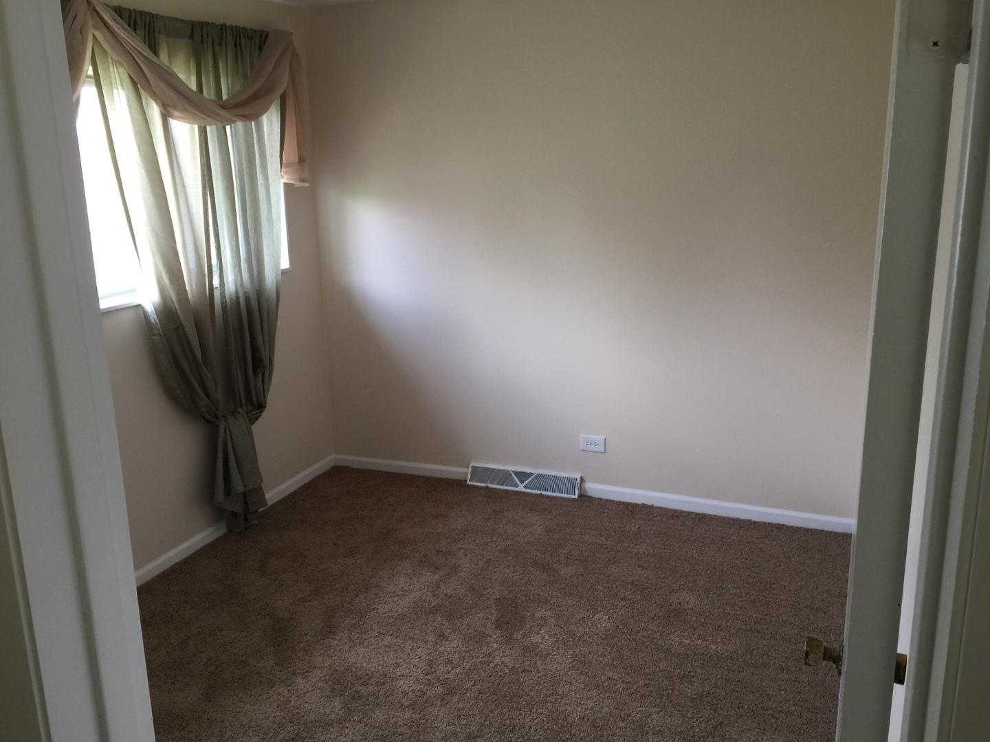 8010 West Lyons Street, Unit B Niles, IL 60714 - Photo 10 of 19 a view of an empty room with a window
