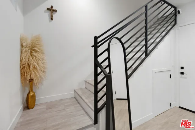 a view of entryway with wooden floor