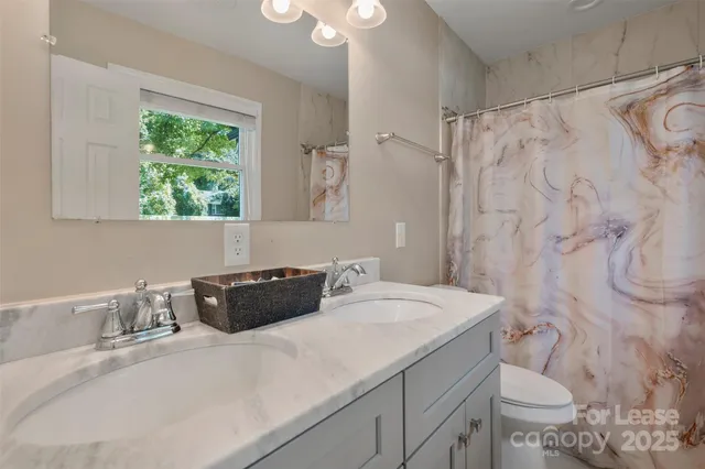 a bathroom with a sink and a toilet