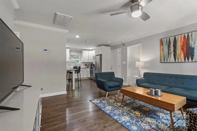 a living room with furniture and a rug