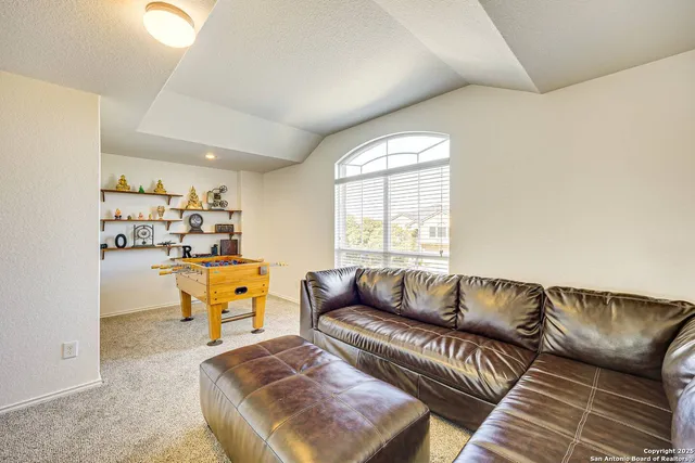 a living room with furniture and a window