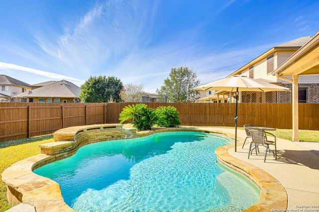 a view of a backyard with a patio