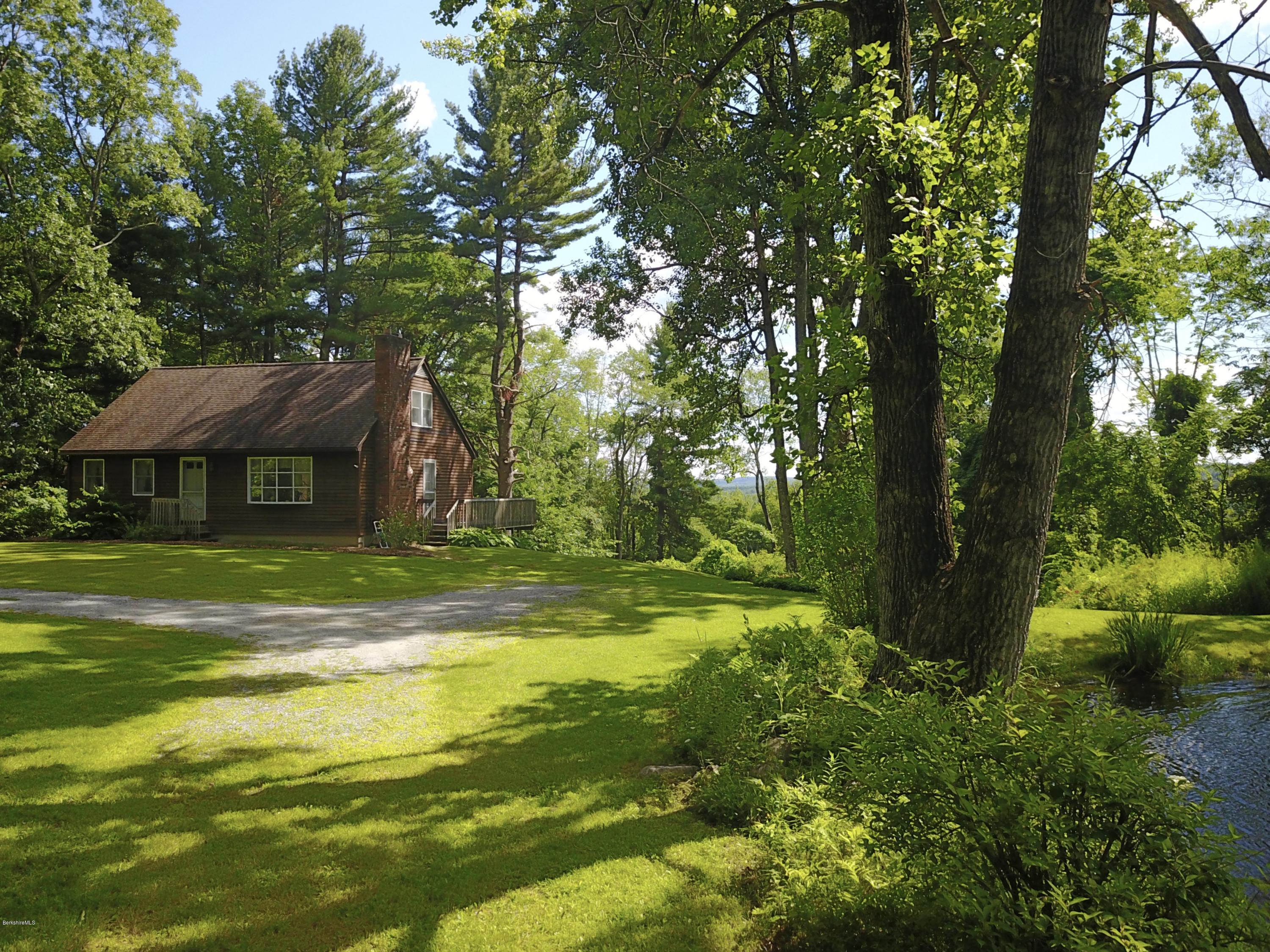 51 Main Road Monterey, MA 01230 - Photo 2 of 17 a view of a house with a yard