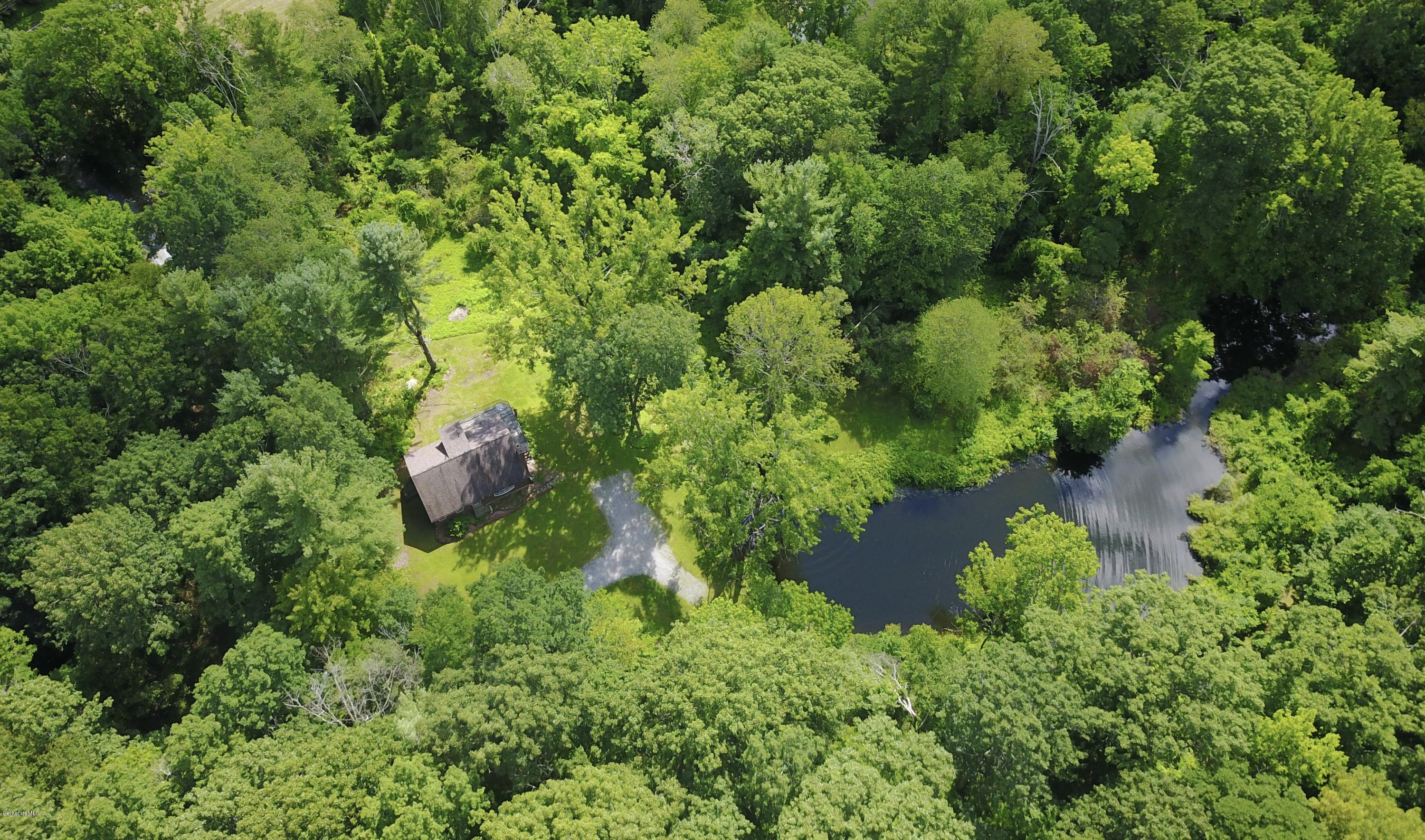 51 Main Road Monterey, MA 01230 - Photo 3 of 17 an aerial view of residential house with outdoor space and trees all around