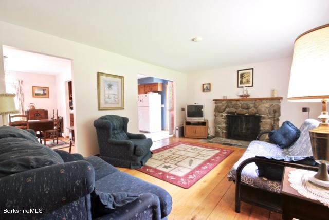 51 Main Road Monterey, MA 01230 - Photo 4 of 17 a living room with furniture and a fireplace