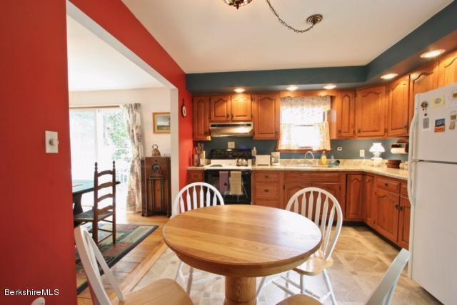 51 Main Road Monterey, MA 01230 - Photo 5 of 17 a dining room with furniture and a large window
