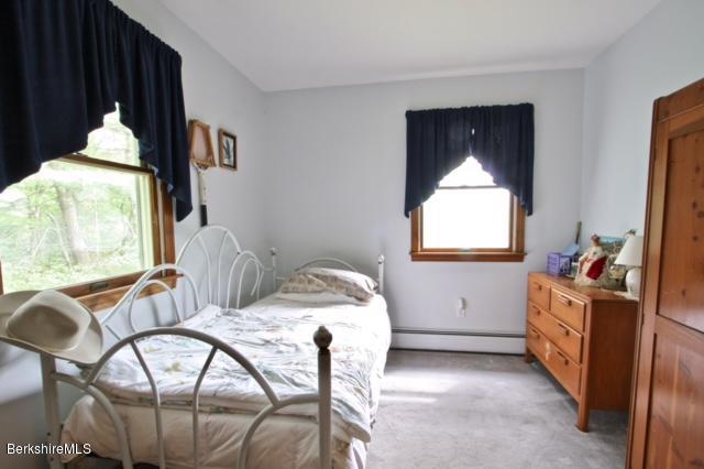 51 Main Road Monterey, MA 01230 - Photo 9 of 17 a bedroom with furniture and a window
