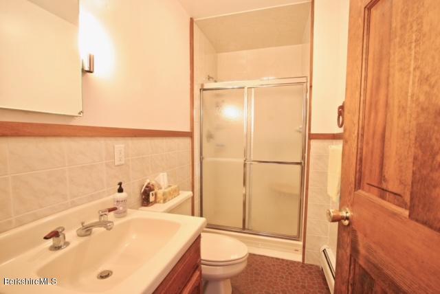 51 Main Road Monterey, MA 01230 - Photo 10 of 17 a bathroom with a sink a toilet and shower