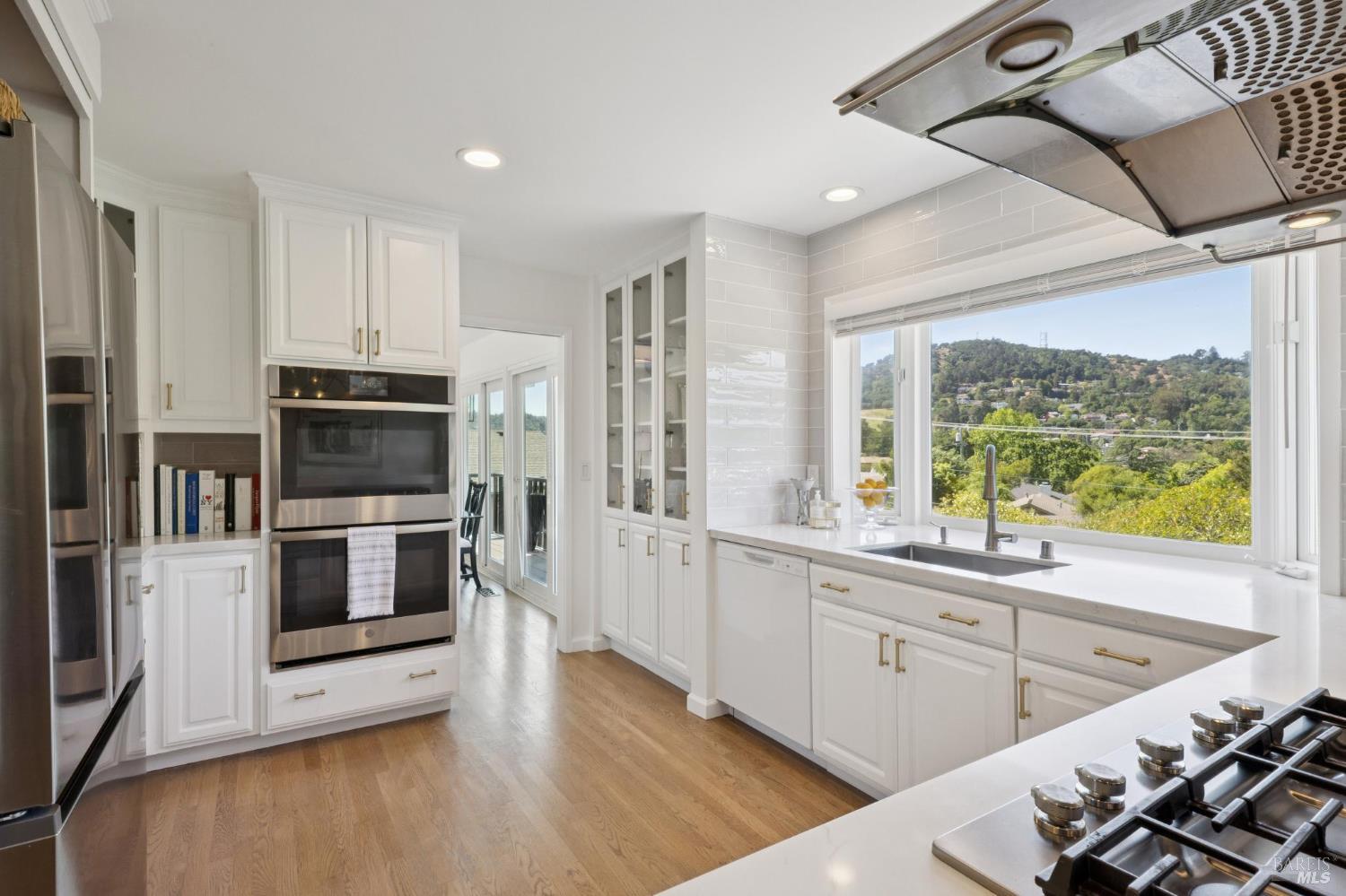 1380 Grand Avenue San Rafael, CA 94901 - Photo 16 of 46 a kitchen with stainless steel appliances kitchen island granite countertop a stove and a sink