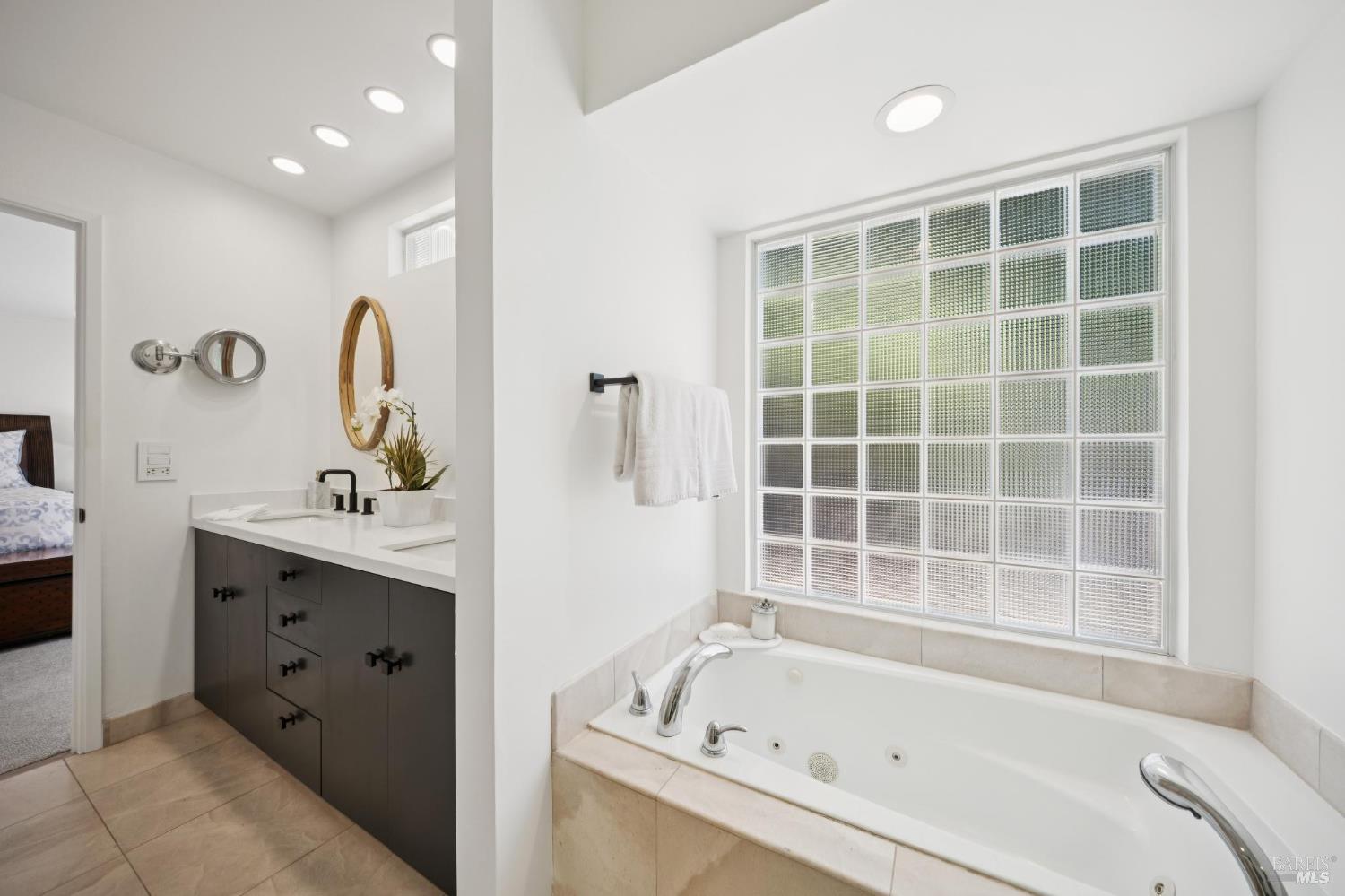 1380 Grand Avenue San Rafael, CA 94901 - Photo 29 of 46 a bathroom with a bathtub sink and mirror