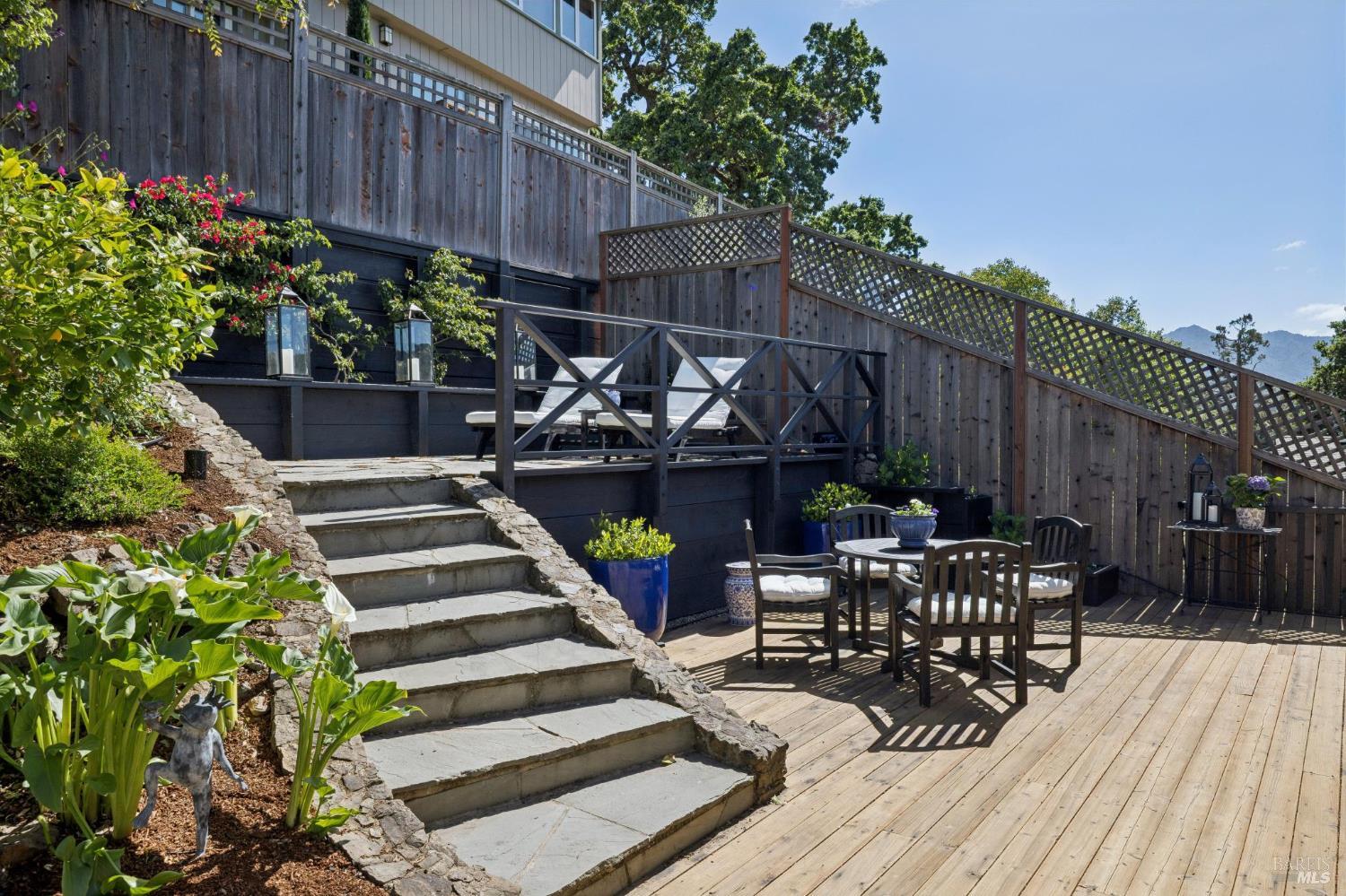 1380 Grand Avenue San Rafael, CA 94901 - Photo 39 of 46 a view of a table and chairs in patio with wooden fence