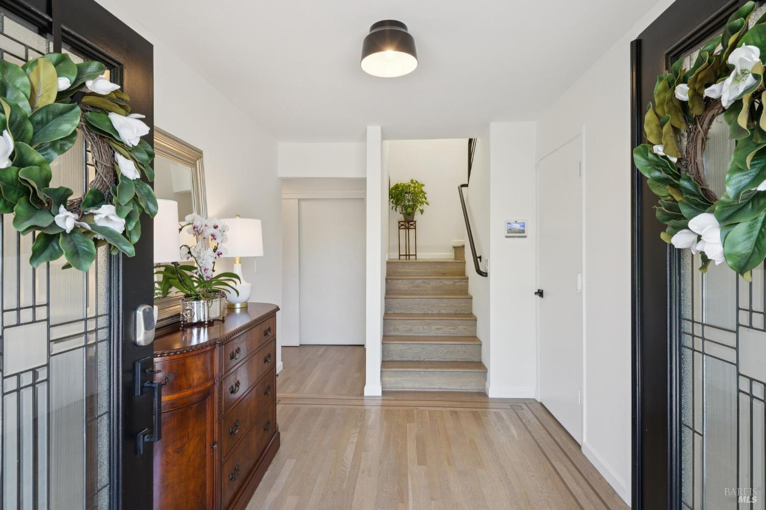 1380 Grand Avenue San Rafael, CA 94901 - Photo 5 of 46 a view of a hallway to a window and potted plants
