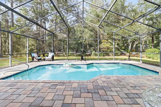 a view of a swimming pool with a lounge chair