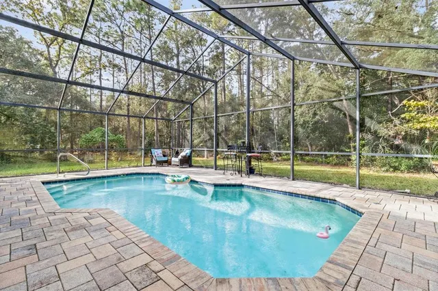 a view of a swimming pool with a patio