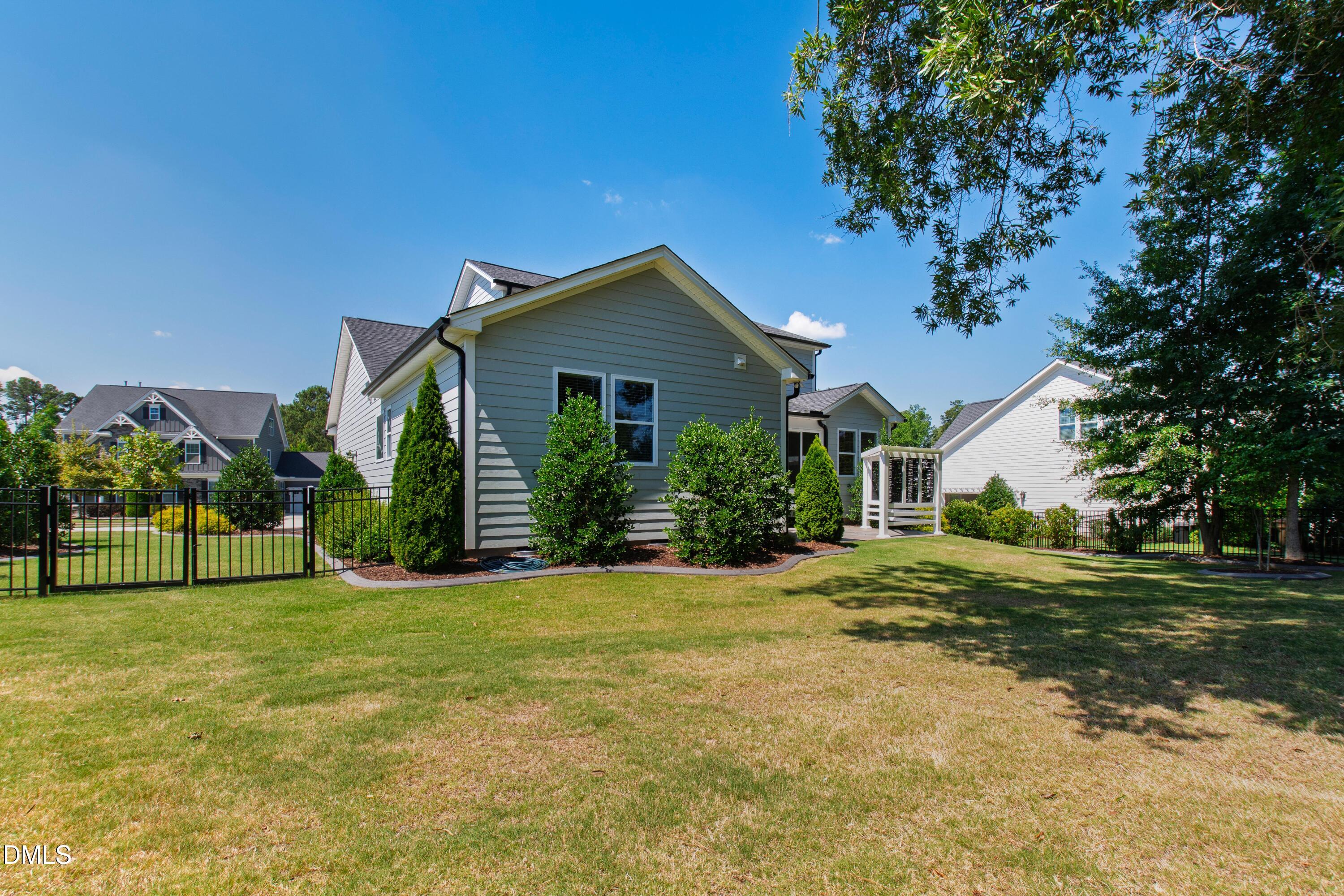 1300 Commons Ford Place Apex, NC 27539 - Photo 61 of 70 a front view of house with yard and green space