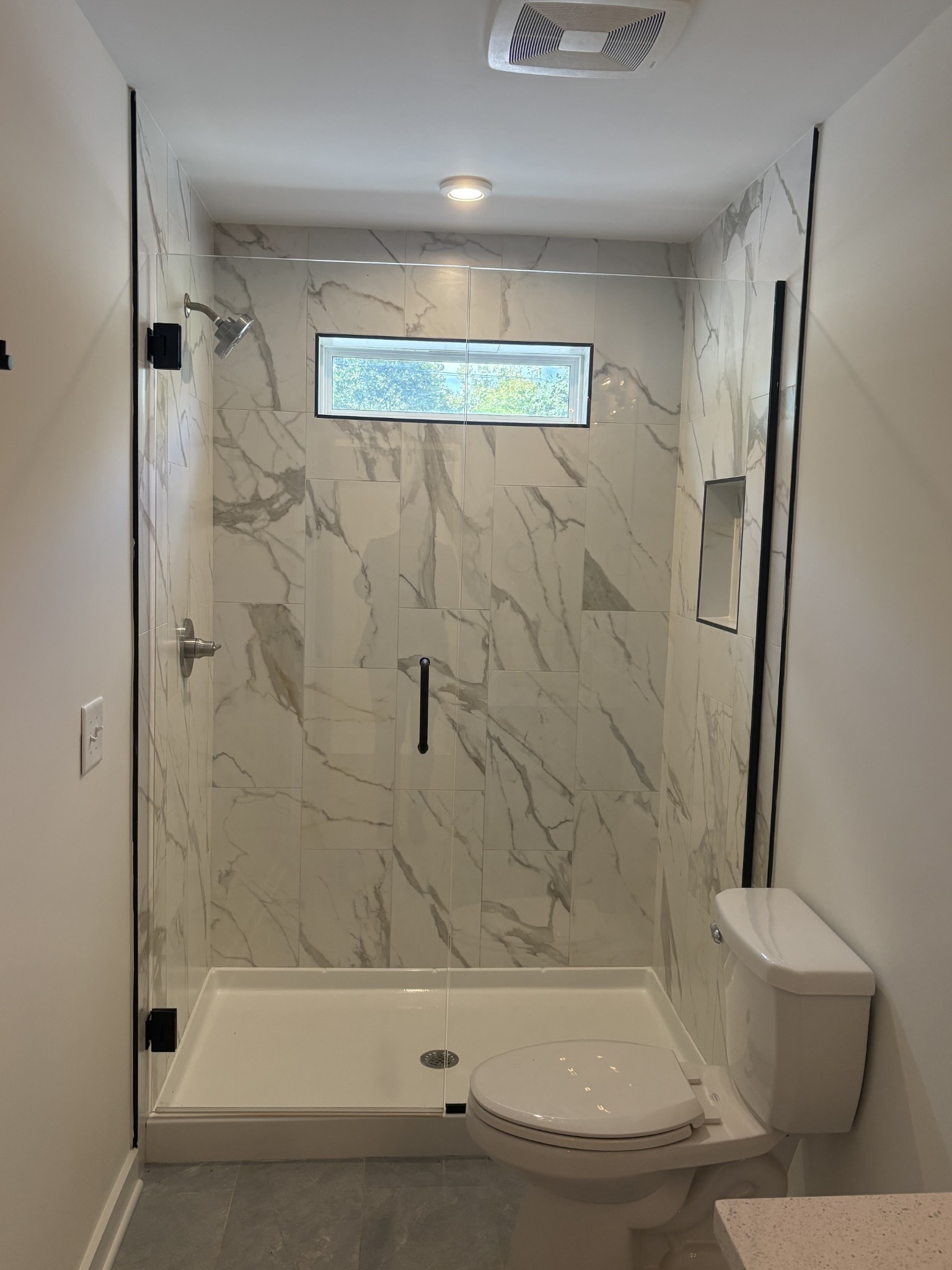 609 Wallace Road Nashville, TN 37211 - Photo 16 of 38 a bathroom with a bathtub and a shower