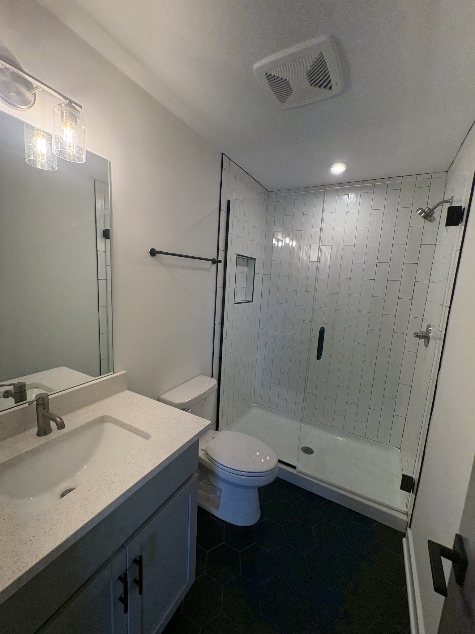 609 Wallace Road Nashville, TN 37211 - Photo 20 of 38 a bathroom with a sink a toilet a shower and a mirror