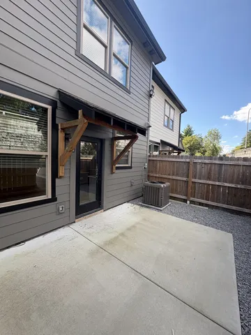a view of a house with wooden fence