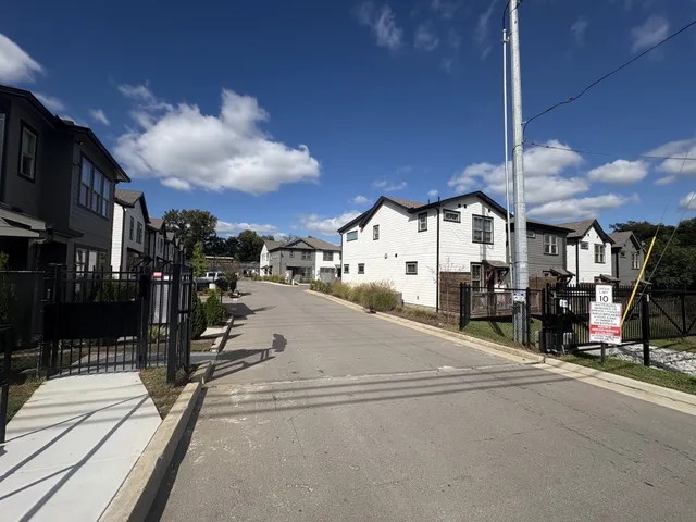 a view of a street with stores