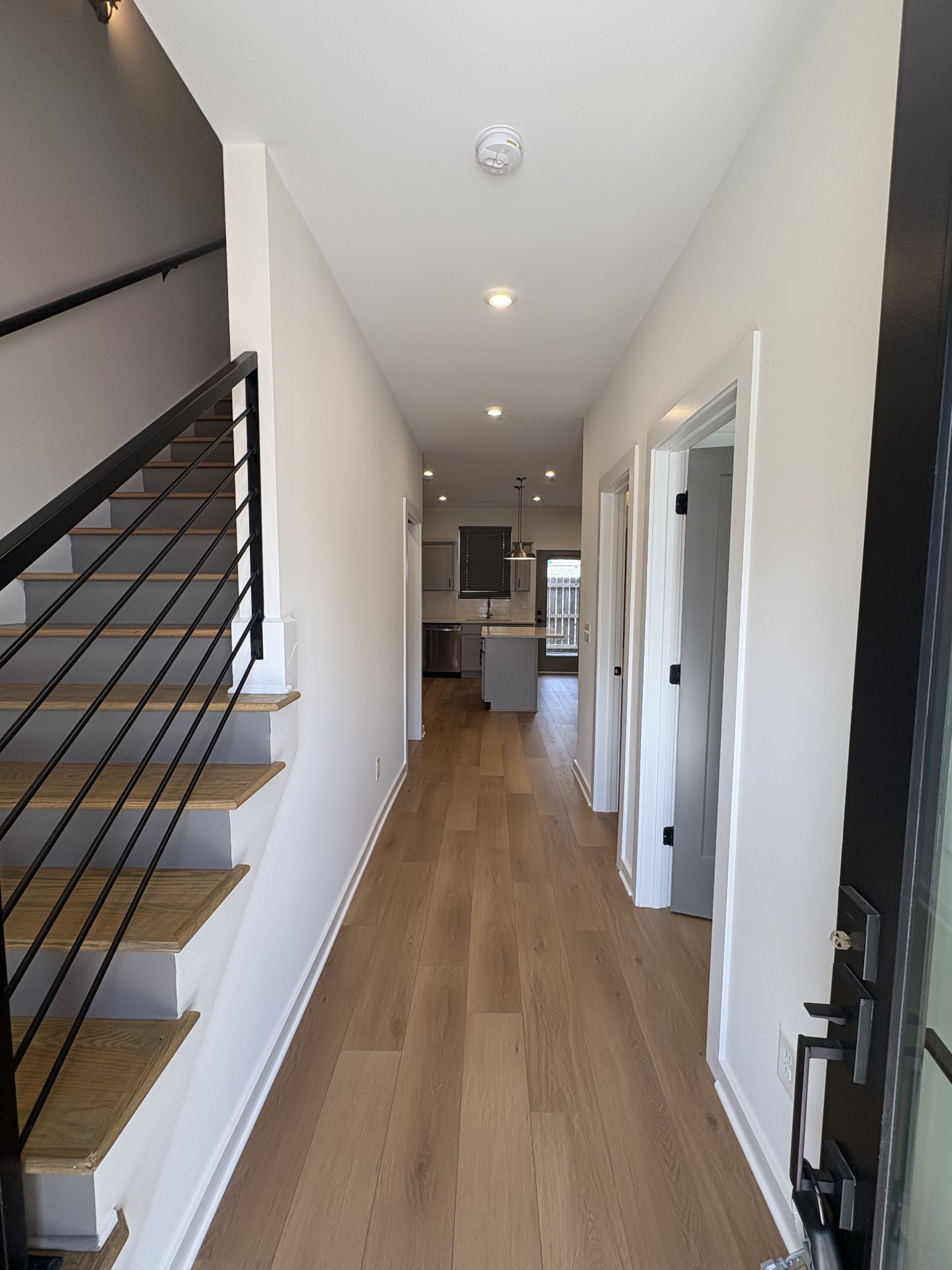 609 Wallace Road Nashville, TN 37211 - Photo 5 of 38 a view of a hallway with wooden floor and staircase