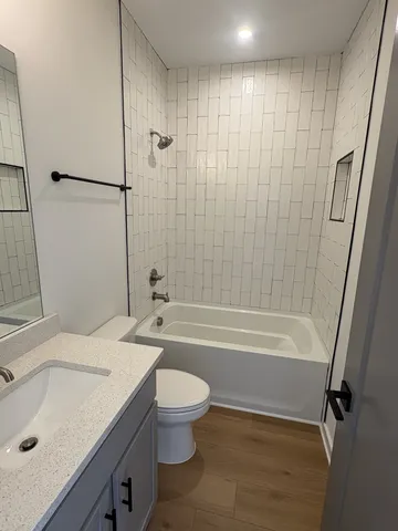 a bathroom with a sink a toilet and a bathtub