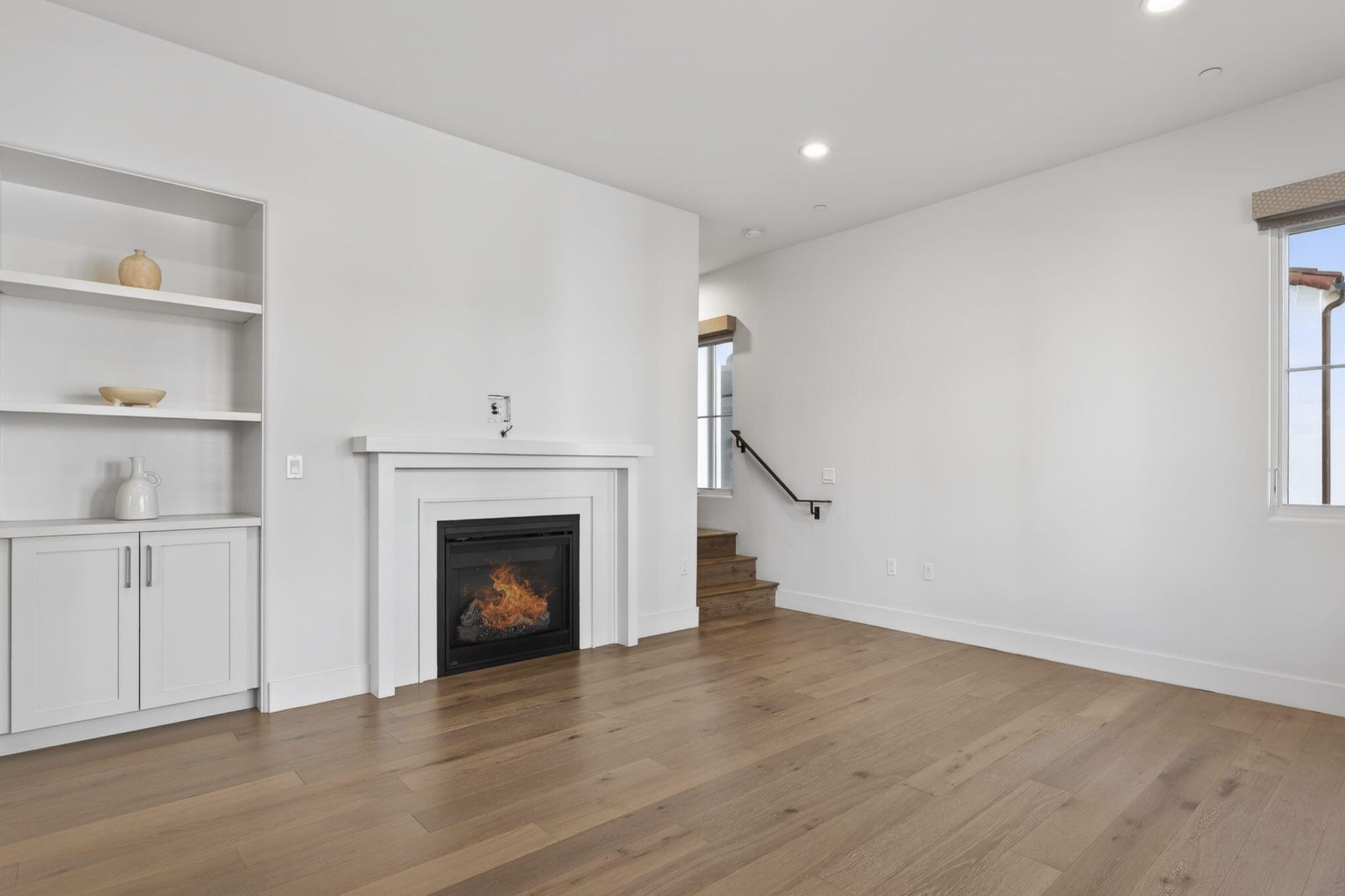 3718 State Street, Unit 139 Santa Barbara, CA 93105 - Photo 11 of 34 a view of an empty room with wooden floor fireplace and a window