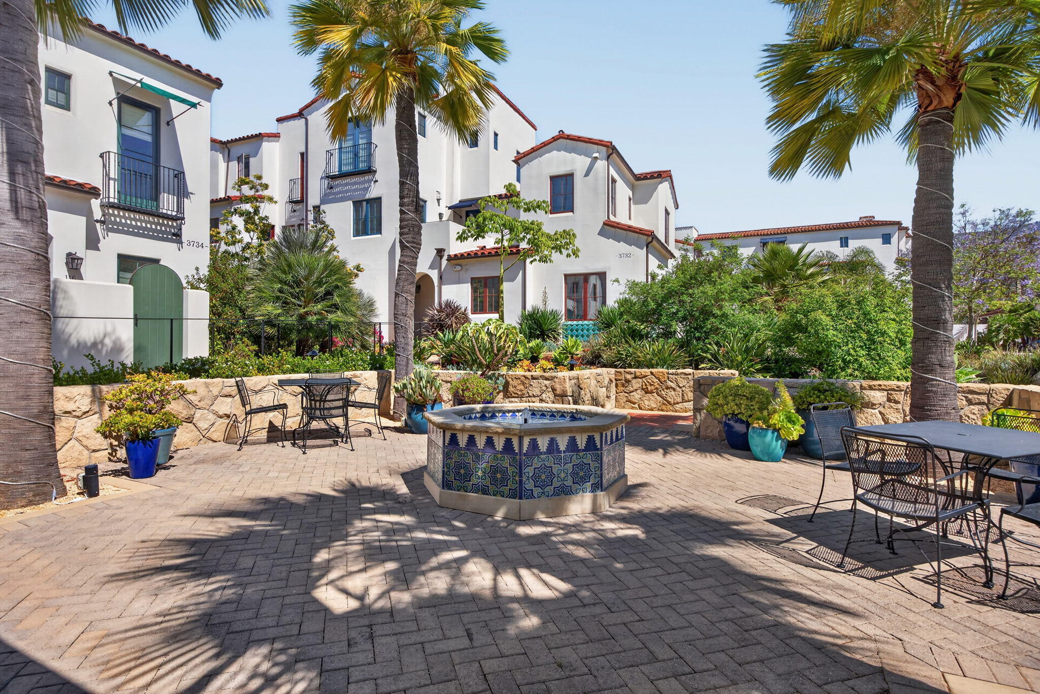 3718 State Street, Unit 139 Santa Barbara, CA 93105 - Photo 33 of 34 a view of a patio with couches table and chairs and potted plants