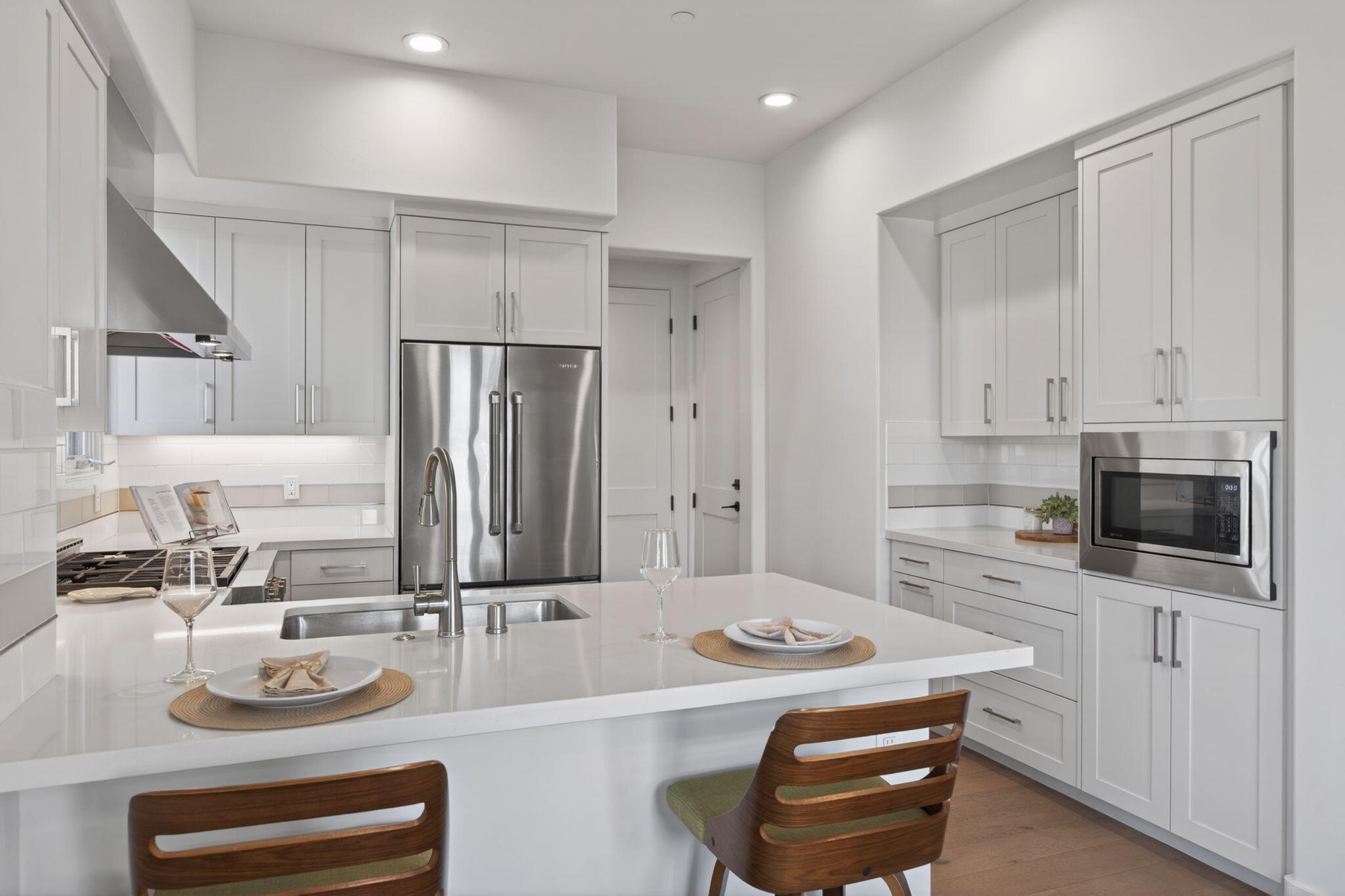 3718 State Street, Unit 139 Santa Barbara, CA 93105 - Photo 4 of 34 a kitchen with a sink a stove and chairs