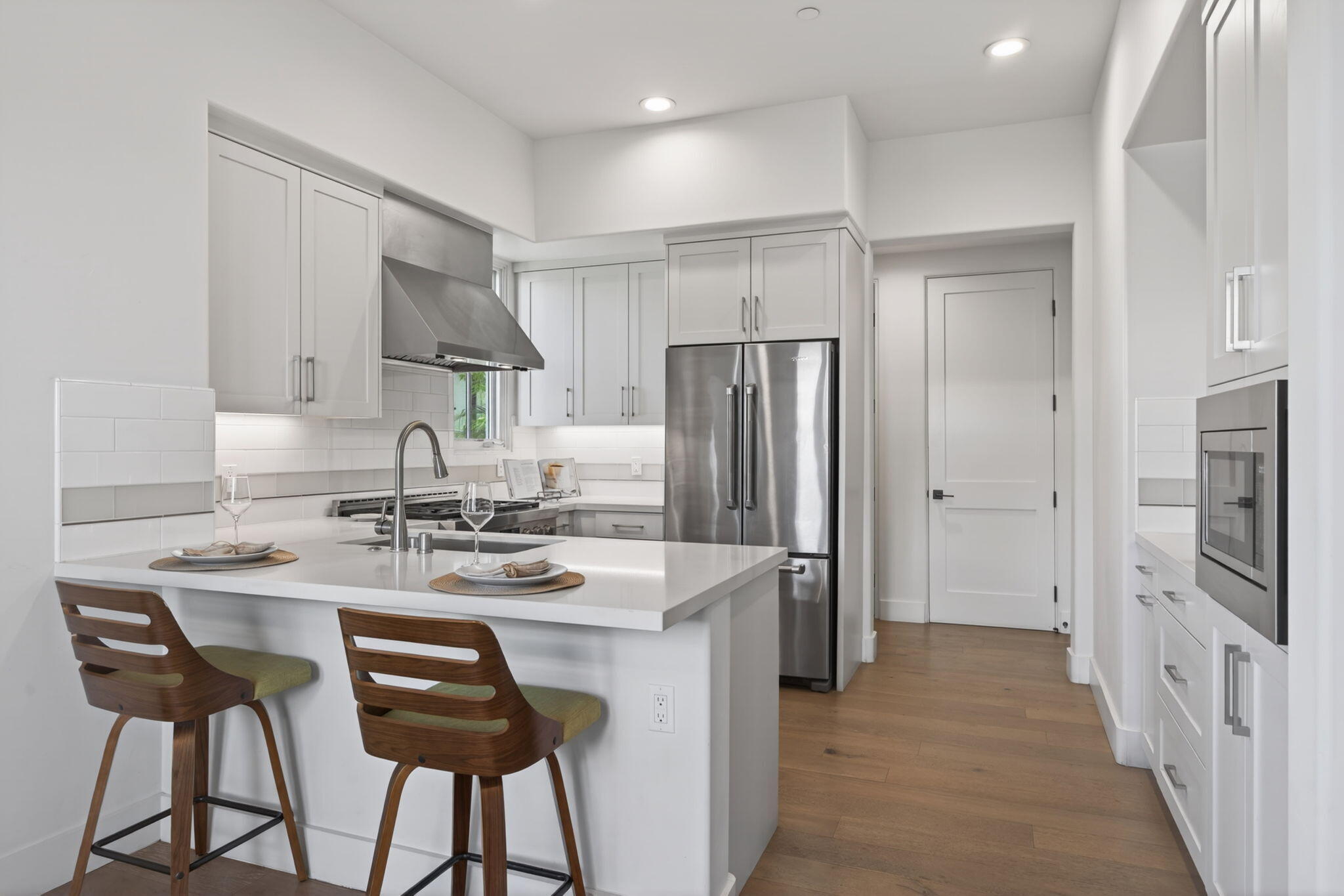 3718 State Street, Unit 139 Santa Barbara, CA 93105 - Photo 6 of 34 a kitchen with stainless steel appliances granite countertop a dining table chairs refrigerator and cabinets