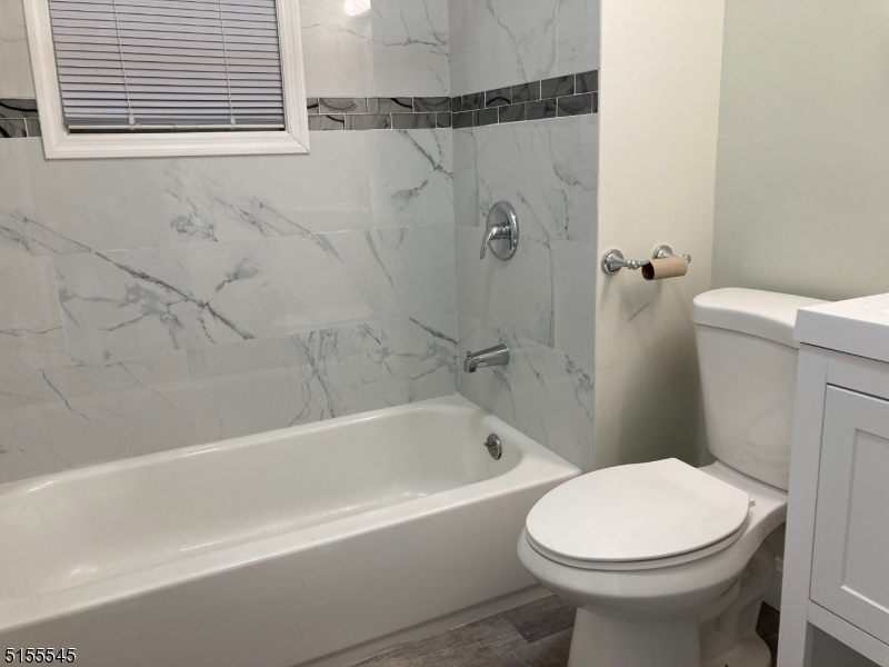 134 South 7th Street, Unit 2 Newark, NJ 07107 - Photo 12 of 13 a bathroom with a sink and a toilet