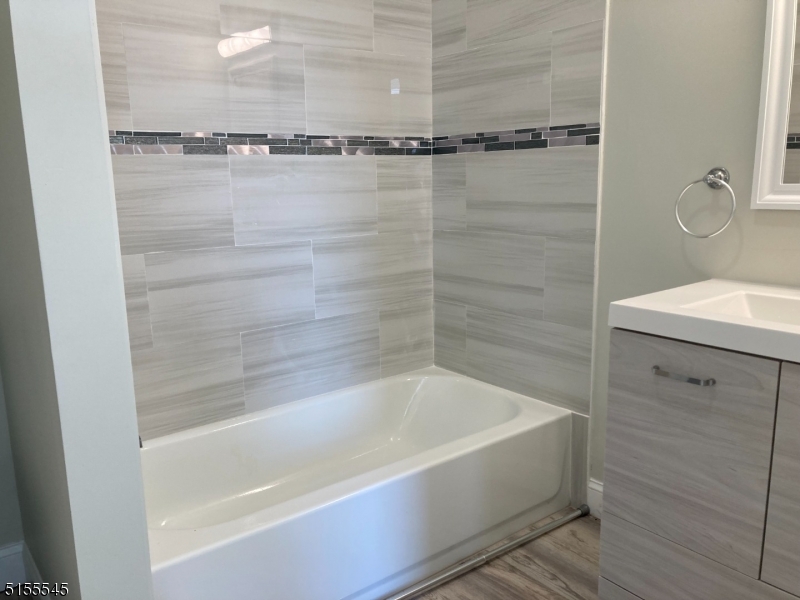 134 South 7th Street, Unit 2 Newark, NJ 07107 - Photo 9 of 13 a bathroom with a bathtub