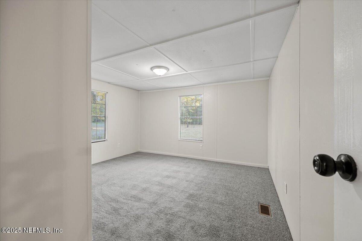 1480 Brangus Road Middleburg, FL 32068 - Photo 17 of 24 an empty room with windows