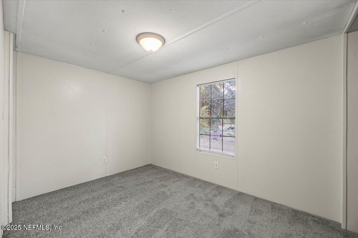 1480 Brangus Road Middleburg, FL 32068 - Photo 20 of 24 an empty room with windows