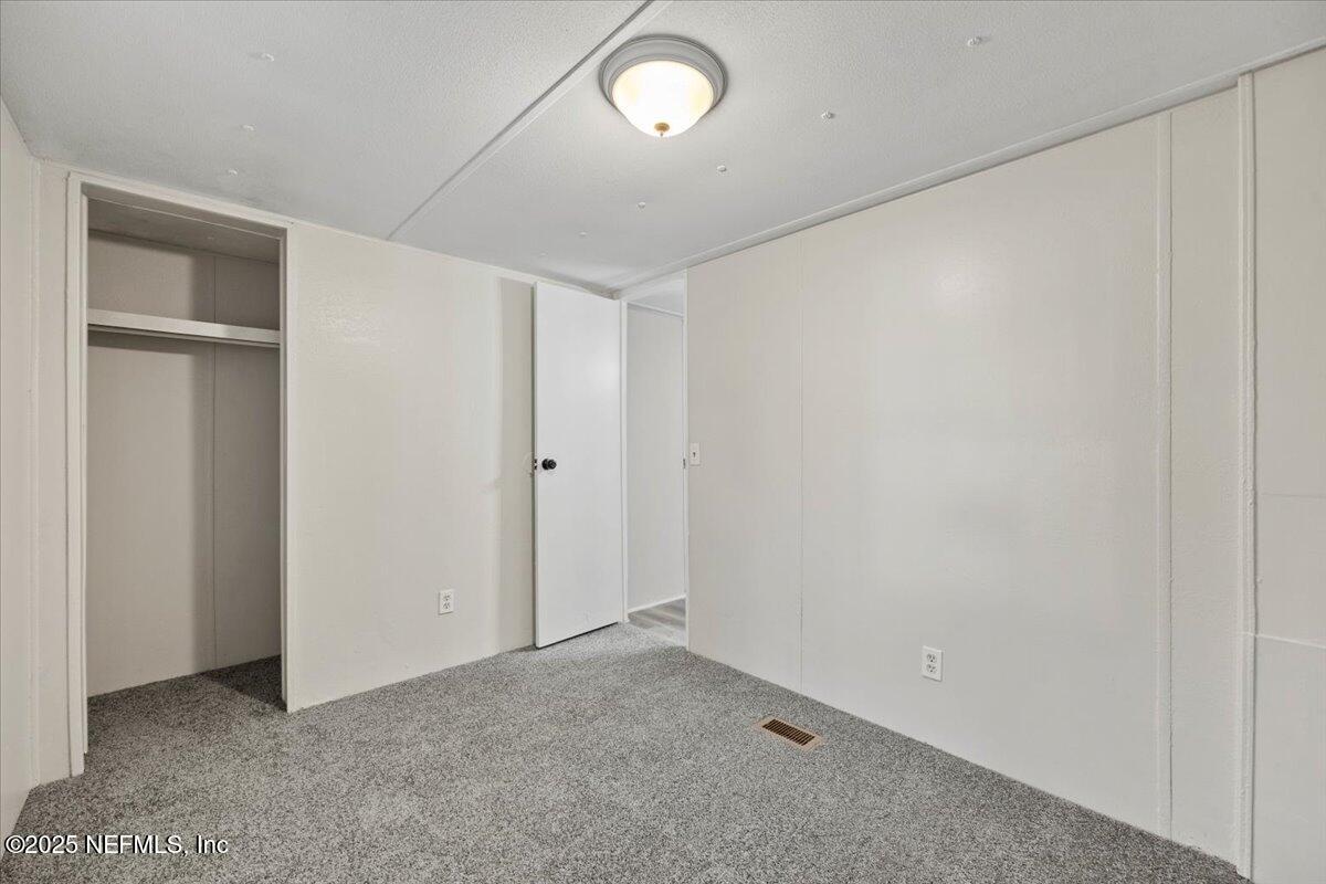 1480 Brangus Road Middleburg, FL 32068 - Photo 21 of 24 an empty room with a empty space and a window