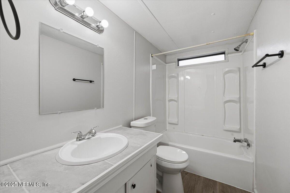 1480 Brangus Road Middleburg, FL 32068 - Photo 22 of 24 a bathroom with a sink a toilet and shower