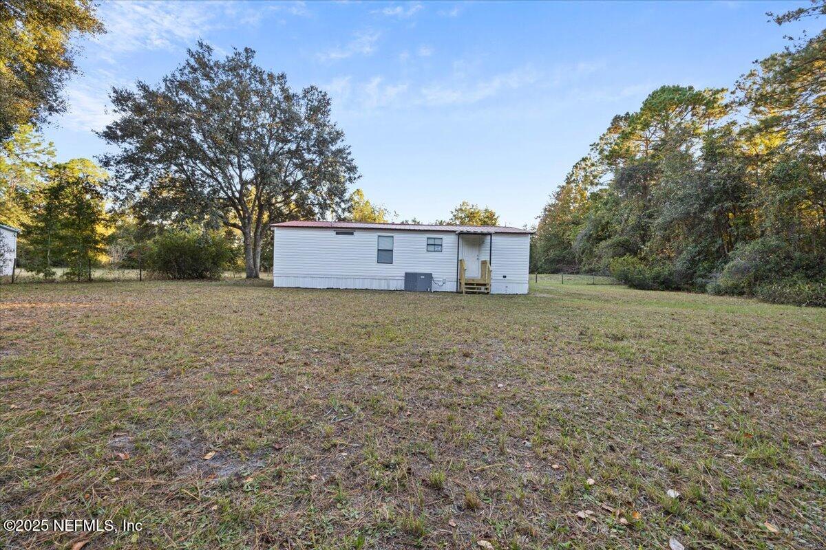 1480 Brangus Road Middleburg, FL 32068 - Photo 23 of 24 a view of a house with a yard