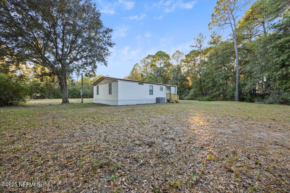 1480 Brangus Road Middleburg, FL 32068 - Photo 24 of 24 a backyard of a house with lots of green space