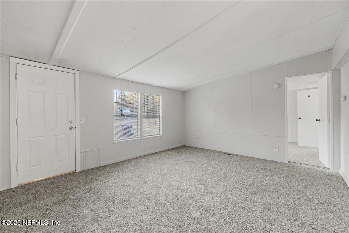 1480 Brangus Road Middleburg, FL 32068 - Photo 5 of 24 a view of an empty room with windows