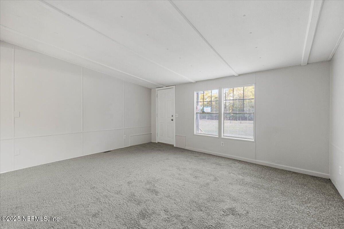 1480 Brangus Road Middleburg, FL 32068 - Photo 6 of 24 an empty room with a window